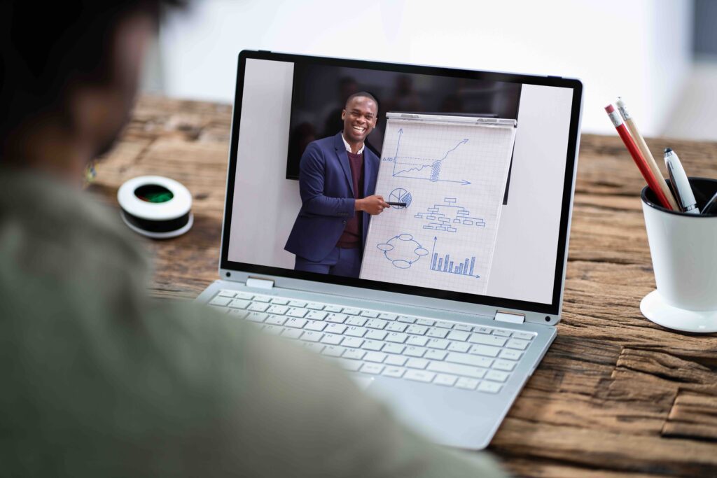 Man Participating In Online Coaching Session Using Laptop